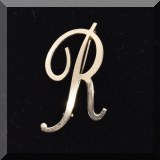 J144. Goldtone ”R” pin - $12 